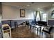 Community Lounge with couches, tables, chairs, and TV at 4221 W Spruce St # 1303, Tampa, FL 33607
