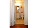 A half-bath with a single sink vanity, white toilet, and tiled floor at 4345 Tahitian Gardens Cir # C, Holiday, FL 34691