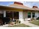 Inviting front porch with various potted plants and exterior decorations, leading to the main entrance at 4345 Tahitian Gardens Cir # C, Holiday, FL 34691