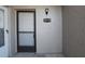 Close-up of a unit entrance featuring the unit number and an outdoor light fixture at 4513 S Oak Dr # Q31B, Tampa, FL 33611
