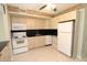 Functional kitchen featuring ample cabinetry and white appliances for a clean, cohesive look at 4513 S Oak Dr # Q31B, Tampa, FL 33611