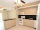 Modern kitchen with a breakfast bar and easy access to appliances and dining area at 4513 S Oak Dr # Q31B, Tampa, FL 33611