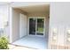 Covered patio area with sliding glass door at 4513 S Oak Dr # Q31B, Tampa, FL 33611