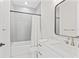 Clean bathroom with shower-tub combination, grey tile, and vanity with mirror at 4911 N Nebraska Ave, Tampa, FL 33603