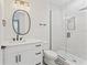 Stylish bathroom featuring a glass-enclosed shower, modern vanity, and elegant fixtures at 4911 N Nebraska Ave, Tampa, FL 33603