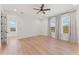 Bright bedroom featuring hardwood floors, recessed lighting, ceiling fan, and sunlit windows at 4911 N Nebraska Ave, Tampa, FL 33603