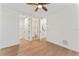 Bright bedroom with hardwood floors, ceiling fan and ensuite bathroom at 4911 N Nebraska Ave, Tampa, FL 33603