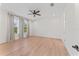 Bright bedroom features hardwood floors, recessed lighting, ceiling fan, and sunlit windows at 4911 N Nebraska Ave, Tampa, FL 33603