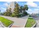 Modern exterior featuring lush landscaping and a sidewalk near a commercial area at 4911 N Nebraska Ave, Tampa, FL 33603
