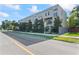 Long shot of a modern apartment complex with street view on a sunny day with blue skies at 4911 N Nebraska Ave, Tampa, FL 33603