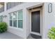 Elegant front entrance with a modern design, security camera, and address number at 4911 N Nebraska Ave, Tampa, FL 33603