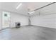 Spacious garage with epoxy flooring, washer/dryer hookups, and access to the house at 4911 N Nebraska Ave, Tampa, FL 33603