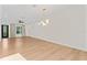 Bright, expansive living room with light wood floors and modern lighting at 4911 N Nebraska Ave, Tampa, FL 33603