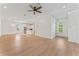 Spacious open-concept living room with hardwood floors and kitchen view at 4911 N Nebraska Ave, Tampa, FL 33603