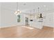 Bright and airy open floor plan with modern lighting fixtures and a stylish kitchen island at 4911 N Nebraska Ave, Tampa, FL 33603