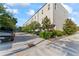 Exterior view showing building parking and trees in a landscaped setting at 4911 N Nebraska Ave, Tampa, FL 33603