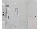Walk-in shower with glass surround, rainfall shower head and built-in bench at 4911 N Nebraska Ave, Tampa, FL 33603