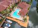 Aerial view of community pool, boat dock, and landscaping at 5000 Culbreath Key Way # 4-108, Tampa, FL 33611