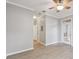 Spacious living room featuring hardwood floors, a ceiling fan, and access to the outside at 5000 Culbreath Key Way # 4-108, Tampa, FL 33611