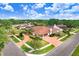 Beautiful aerial view of house, mature trees, landscaping, and paver driveway at 5112 Lanai Way, Tampa, FL 33624