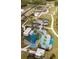 Expansive aerial view showcases the community playground and pool amenities, inviting outdoor fun and recreation at 5112 Lanai Way, Tampa, FL 33624