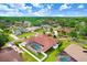 Aerial view of a neighborhood showcasing a single Gathering home with a screened in pool at 5112 Lanai Way, Tampa, FL 33624