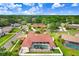 Aerial view of a single Gathering home featuring a private screened in pool and lush landscaping at 5112 Lanai Way, Tampa, FL 33624