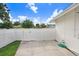 Fenced-in backyard with a small patio area at 5112 Lanai Way, Tampa, FL 33624