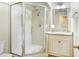 Bathroom showcasing a glass enclosed shower and a vanity with granite countertops at 5112 Lanai Way, Tampa, FL 33624