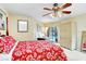 Bedroom featuring fan, closet, and sliding glass doors offering access to a private pool area at 5112 Lanai Way, Tampa, FL 33624