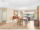 Bright dining room with hardwood floors, chandelier, and furniture at 5112 Lanai Way, Tampa, FL 33624