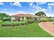 Well-maintained one-story home featuring a lush lawn and a decorative brick driveway at 5112 Lanai Way, Tampa, FL 33624