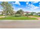 Inviting single-story home showcasing a winding brick driveway and beautifully landscaped yard at 5112 Lanai Way, Tampa, FL 33624