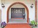 Charming front entrance featuring a brick archway and double doors with decorative glass at 5112 Lanai Way, Tampa, FL 33624