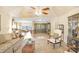 Spacious living room featuring hardwood floors, a ceiling fan, and an open layout at 5112 Lanai Way, Tampa, FL 33624