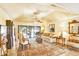 Comfortable living room with tray ceilings and access to outdoor pool area at 5112 Lanai Way, Tampa, FL 33624