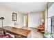 Bright home office with a classic desk, wood-look flooring, and open space at 5112 Lanai Way, Tampa, FL 33624