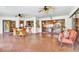 Spacious covered patio with brick flooring, dining area, and views of the pool at 5112 Lanai Way, Tampa, FL 33624