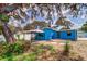 Wide backyard with gazebo, landscaping, privacy fence, mature trees, and well-maintained lawn at 520 4Th Nw St, Largo, FL 33770