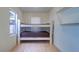 Bedroom featuring tile floors and built in bunk beds at 520 4Th Nw St, Largo, FL 33770