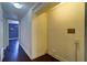 Hallway featuring hardwood floors and wall fixtures for washer and dryer hookups at 520 4Th Nw St, Largo, FL 33770