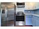 Kitchen featuring modern stainless steel appliances, stylish cabinets, and countertops at 520 4Th Nw St, Largo, FL 33770