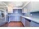 Kitchen with stainless steel appliances, blue cabinets, and ample counter space at 520 4Th Nw St, Largo, FL 33770