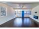 Spacious living room with large windows and dark wood floors at 520 4Th Nw St, Largo, FL 33770