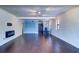 Open-concept living space with fireplace and easy access to the kitchen at 520 4Th Nw St, Largo, FL 33770