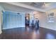 Bright living and dining space with dark wood floors and open access to the kitchen at 520 4Th Nw St, Largo, FL 33770