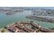 Aerial view showcasing waterfront condos with boating access and a community pool at 531 Sandy Hook Rd, Treasure Island, FL 33706