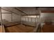 Interior view of attic with ventilation, insulation, and wood floor at 531 Sandy Hook Rd, Treasure Island, FL 33706