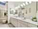 Spacious bathroom with double sinks, jacuzzi tub, mirrors, and ample lighting at 531 Sandy Hook Rd, Treasure Island, FL 33706