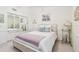 Cozy bedroom with mirrored closet doors and comfortable furnishings at 531 Sandy Hook Rd, Treasure Island, FL 33706